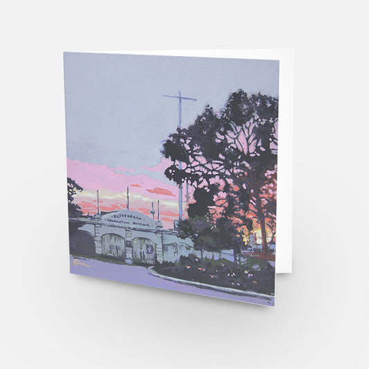 Greeting card with a scenic view of a building and trees at sunrise.